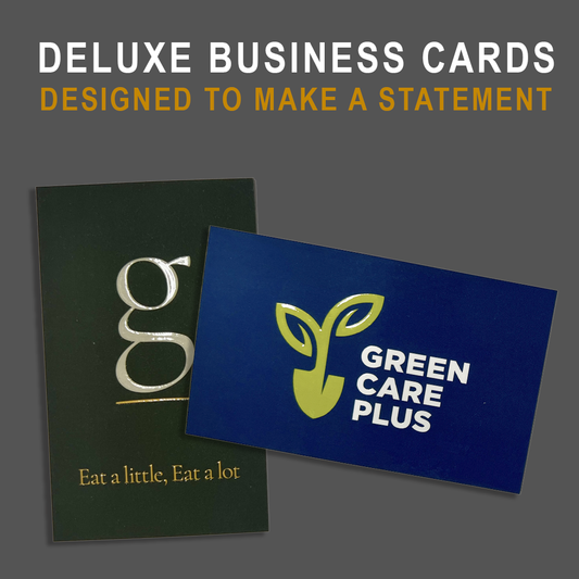 Two business cards, one green with a raised clear 'g' and the other blue with a green raised leaf logo for Green Care Plus, on a gray background.